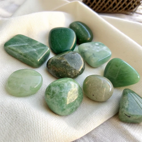 Nephrite Jade Stones Closeup Close-up of various shaped nephrite jade stones showing natural color variations and polished surfaces